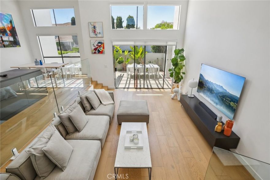 Modern Luxury Close to Woodbridge Lake! Welcome to your dream home in the heart of the highly desirable LakeShore community! This stunning three-level townhome offers the perfect blend of style, space, and comfort. Located just steps from picturesque Woodbridge Lake, this home places you at the center of a vibrant and amenity-rich neighborhood. From the moment you walk in, soaring ceilings create a sense of spaciousness. Abundant natural light fills the open-concept living, dining, and kitchen areas. The thoughtfully designed floor plan features open, architecturally integrated stairways spanning three floors. The number of stairs is comparable to that of newer multi-level homes, like those found in Great Park, providing a natural and elegant separation between living, dining, working, and sleeping areas - a design that enhances both functionality and privacy across all three levels. This spacious home boasts an extra-large primary suite complete with a generous walk-in closet for optimal organization. Two additional well-sized bedrooms provide comfort for family or guests. A large bonus room is ideal for a home office or cozy family retreat. For added convenience, full-size laundry and storage rooms are located on the top floor. The kitchen stands as a true centerpiece. Sleek, minimalist cabinetry offers a modern aesthetic, while a striking center island provides ample space for meal preparation and gathering. State-of-the-art, energy-efficient appliances make cooking easy and eco-friendly. Smart design details set this home apart. Enjoy recessed lighting throughout, app-connected smoke detectors, smart switches, and programmable thermostats. These modern upgrades create a comfortable, and technologically living environment. Living in WB means enjoying world-class amenities: two sparkling lakes with beach lagoons, 21 swimming pools, tennis courts, scenic walking trails, and lush parks. The community regularly hosts seasonal events at Woodbridge Lake, giving residents the chance to connect and celebrate throughout the year. Families will appreciate being close to top-rated, award-winning schools such as Meadow Park Elementary and Woodbridge High School, ensuring a high-quality education just minutes from home. Homes in LakeShore with this level of upgrades and access to exceptional amenities are rarely available. Don’t wait - schedule your tour today and experience the best of living by the lake. Opportunities like this are truly one-of-a-kind!