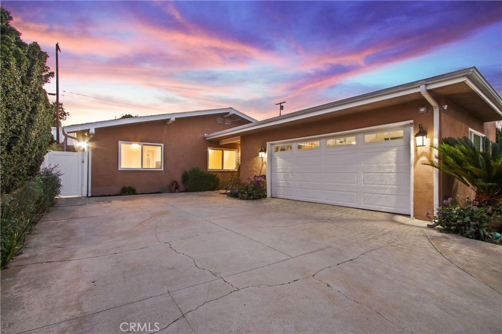 Welcome to this beautifully updated single-level home located in the highly sought-after Taper Avenue area of North San Pedro. Built in 1961, this 4-bedroom, 2-bathroom residence offers 1,430 sq. ft. of thoughtfully designed living space with a balance of comfort, style, and modern upgrades. Inside, the home flows effortlessly from the dining area into a bright galley kitchen that was recently remodeled, featuring white cabinetry, quartz countertops, and sparkling stainless steel appliances, including a freestanding gas range, microwave, dishwasher, and refrigerator with a water line. Off the kitchen, the finished attached 2-car garage includes recessed lighting, washer and dryer hookups, a utility sink, newer garage door, Gorilla Racks, its own AC system, and 220V power, perfect for storage, hobbies, or workspace needs. The spacious living room is the heart of the home, showcasing hardwood flooring, a cozy fireplace, crown molding, recessed lighting, built-in speakers, and sliding glass doors that open to the fenced backyard. A remodeled full bathroom, three bedrooms with ceiling fans, and a primary suite with a remodeled ¾ bath complete the private living quarters. The backyard is a true highlight, designed for both relaxation and fun. It offers the perfect spot for a firepit to gather around on cool evenings, while the terraced layout is ideal for setting up cornhole boards or other outdoor games. Additional highlights include central heating and a new AC unit, copper water lines through the attic, newer attic insulation, a new 200-amp electrical panel, tile flooring in both bathrooms, and modern security features with a hardwired ADT system and Ring camera system (6 cameras). The exterior has been equally enhanced with a vinyl-fenced backyard with a natural gas hookup for a BBQ or firepit, new vinyl fencing on the upper terraced yard, automatic sprinklers in the front, and a front yard drip system. Situated in a quiet and convenient neighborhood close to schools, shopping, and parks, this home offers the perfect opportunity to enjoy the best of San Pedro living in comfort and style.