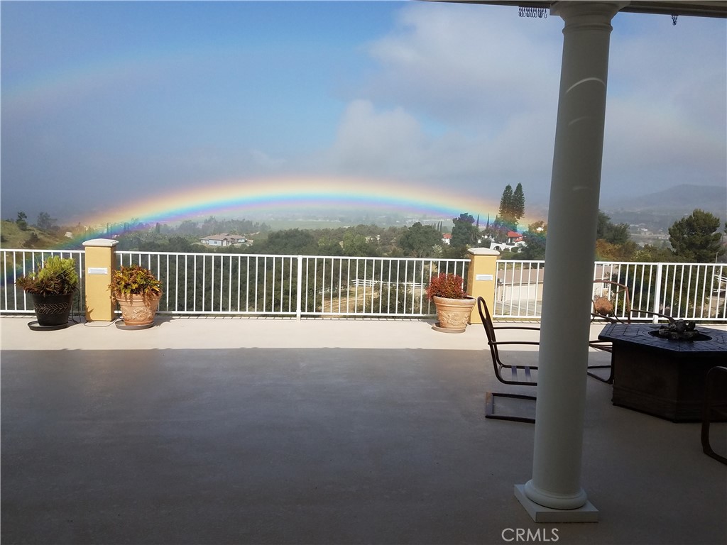 Welcome Home to this original owner gated custom home! Views! Views! Views! Featuring over 7500 square feet of total usable living space. The main level boasts over 3800 square feet with 3 spacious bedrooms, 3.5 bathrooms, an office/den, family room with fireplace, formal living with fireplace, formal dining room, huge laundry room with tons of storage, chef’s kitchen with breakfast bar/nook, walk-in pantry and large island with prep sink. The fully finished basement/living space includes a full bath and boundless opportunities. Currently the basement is set up with an expansive bar, game room, gym, and workspace. This custom-built estate is situated on over 5 acres of land for endless views and privacy. There is a total of 8 garage spaces (3 spaces attached to the home), 1 enclosed RV garage, and 2 covered RV spaces. Low-cost solar to keep electricity prices down. Off of the kitchen/family room is a ginormous deck equipped with built-in fire pit and BBQ that is simply stunning! Extreme pride of ownership and no expense spared! Such an elegant home with all of the extra eye for details embracing crown molding, wainscoting, grand pillars, neutral decor, custom cabinetry and built-ins with so much storage. Located just outside of the Glen Oaks Hills HOA on a paved street. Come see this beauty today, you won’t be disappointed!