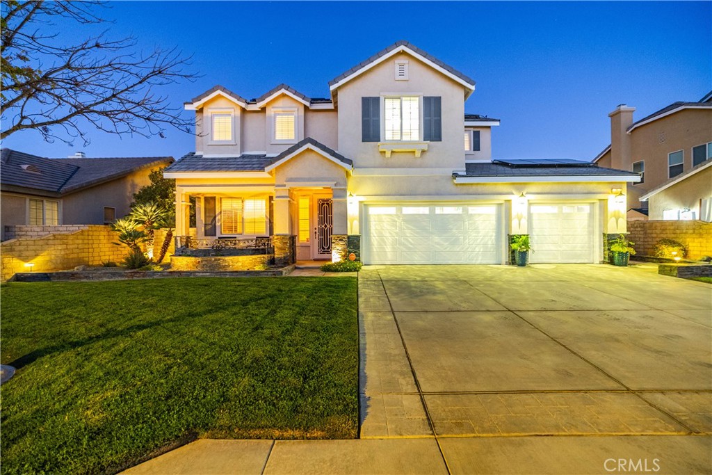 ***LIVE BEAUTIFULLY*** Stunning West Lancaster Home with Exceptional Upgrades. Welcome to this beautifully upgraded 5-bedroom, 3-bath residence offering over 3,200 sq. ft. of living space and a fully finished 3-car garage complete with custom shelving, epoxy flooring, a workbench, and abundant storage. Built in 2004, this home combines timeless design with modern conveniences, creating a perfect blend of comfort and sophistication. From the moment you arrive, the curb appeal is undeniable with lush green grass, custom landscaping, and LED landscape lighting that showcases the property beautifully both day and night. A custom steel security door leads into a grand entryway highlighted by soaring ceilings, while plantation shutters, custom blinds, and window treatments accentuate the elegant design throughout the home. The floor plan is thoughtfully designed, featuring a downstairs bedroom with a full bath, a formal dining room, and a spacious kitchen with abundant cabinetry and a center island that opens to the family room. Here, you’ll find a custom-built entertainment center with lighting, in-ceiling surround sound speakers, and a cozy fireplace, creating the perfect gathering space. Wall-mounted televisions in both the family room and loft will remain with the home, making it truly move-in ready. Upstairs, each bedroom is equipped with custom organizers, and the laundry room offers convenience with its built-in ironing board. The home is equipped with a central vacuum system that extends into the garage, separate smart thermostats for upstairs and downstairs, a built-in intercom system, and a full alarm system for peace of mind. The backyard is an entertainer’s dream, featuring a freshly painted covered patio, a built-in BBQ with refrigerator and sink, and a gas-burning fireplace set beside dual waterfalls. Remote-controlled lighting, fans, and water features enhance the ambiance, while a large wood construction shed—also freshly painted—offers electricity and lighting for endless possibilities. Every detail of this property has been carefully upgraded to provide beauty, functionality, and comfort, making this West Lancaster home a rare opportunity to own a residence that truly has it all.