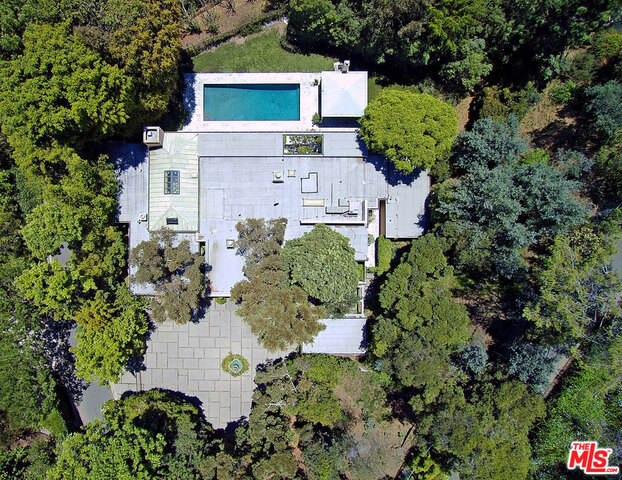 ** PROPERTY IS STILL LISTED AND CAN BE SHOWN BY APPOINTMENT WITH LISTING AGENT. DO NOT CONTACT OWNER! AMAZING OPPORTUNITY JUST GOT BETTER WITH A SIGNIFICANT PRICE REDUCTION! COVETED BEVERLY HILLS NORTH OF SUNSET LOCATION. Former home of baseball legend, Hank Greenberg, this property is located on a quiet cul-de-sac off of Schuyler Road. Built in 1957 as Craig Ellwood's Case Study 18 (the Fields House), the house has been extensively remodeled and altered, and sits on a private, gated lot of just under an acre with city views and beautiful mature tree cover. The original steel frame, pre-fab mid-century house potentially could be restored to its original intent, renovate, add on or build new; the large private lot and view in this prestigious neighborhood present numerous options. Trust Sale, no court confirmation required.