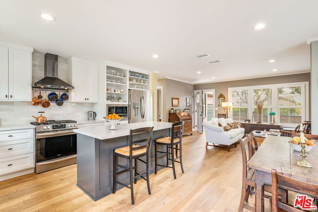 Renovated three-bedroom and two-bathroom home in Culver City. Sited on a tree-lined street, this single-story classic traditional offers turnkey style, comfort, and privacy. Amenities include engineered oak floors, crown mouldings, recessed lights and custom plantation shutters. The open-concept layout features a gourmet kitchen with stainless steel appliances, butcher block shelving and an island with bar seating. Custom bookcases are in living room which flows into the dining area. Primary suite contains a spa-like bathroom with double vanity and glass-enclosed shower. Second bathroom offers equal luxury with shower/tub combo and chic finishes. Newly built deck leads to lush lawn - perfect for kids to play on. Second seating area is tucked away nicely in corner of yard. Perimeter is surrounded by tall mature hedges which creates abundant privacy. Front yard includes drought-tolerant landscaping and is also lined with mature hedges and gated driveway. Located in the award-winning Culver City school district and close to top-rated restaurants and things to do such as Father's Office, Helms Bakery, Trader Joe's, Sprouts, Veteran's Memorial & Sunkist Parks, Sony Studios, Pavilions, and Westfield Culver City Mall.