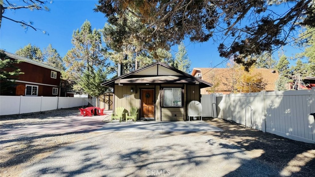 Welcome to your perfect Big Bear City retreat! This charming 2-bedroom, 2-bathroom cabin blends cozy mountain style with modern convenience across 812 square feet of inviting living space. Inside, the open-concept layout features warm wood finishes, vaulted tongue-and-groove ceilings, and a spacious kitchen with stainless steel appliances, stone countertops, and ample cabinet storage—ideal for both everyday comfort and entertaining.
The living area is anchored by a brick fireplace that adds character and warmth, while the dining nook and breakfast bar offer flexible gathering spaces. Natural light fills the interior, highlighting the cabin’s rustic charm and thoughtful layout. Both bedrooms offer peaceful comfort, with closet space and easy access to updated bathrooms.
Step outside and enjoy a fully fenced yard with a large paver patio—perfect for relaxing under the pines. Whether you're looking for a vacation escape, full-time residence, or an investment opportunity, this centrally located Big Bear City home offers it all with easy access to the lake, village, and local trails.