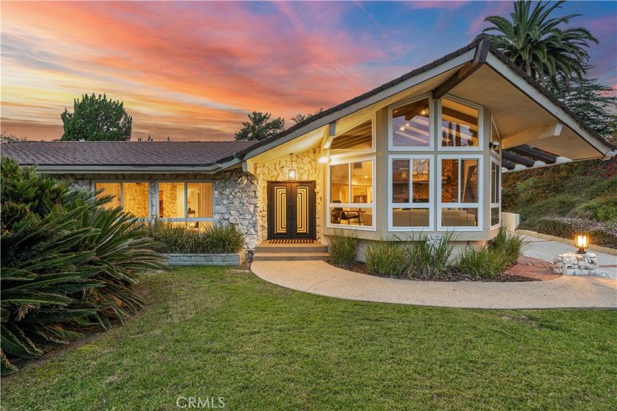 Nestled above Rinaldi near Knollwood Country Club, this 3-bedroom, 3-bath home (with an additional recreation room) offers 2,790 sq. ft. of open living space, a rare 1,398 sq. ft. garage, and a sprawling 18,535 sq. ft. lot — combining classic 1960s architecture with a sense of comfort and possibility Inside, a light-filled open floor plan connects multiple living areas, ideal for both relaxed everyday living and effortless entertaining. The formal living room impresses with cathedral ceilings, floor-to-ceiling picture windows, and a traditional brick wood-burning fireplace, creating a dramatic yet inviting centerpiece. The kitchen offers a cozy breakfast nook, a convenient laundry area, and direct access to the backyard for easy indoor-outdoor flow. Step outside to an entertainer's yard, complete with a sparkling pool, an enclosed patio room, and a detached recreation room — perfect for a pool house, home office, gym, or creative studio. A spacious garage spanning nearly 1,400 SF provides generous parking and storage, easily accommodating multiple vehicles, RVs, or boats, with room to spare for a workshop or fitness. The garage area can also be ideal for an ADU. Experience the tranquility of the Knollwood lifestyle — surrounded by mature greenery, open skies, and the prestige of Country Club living.