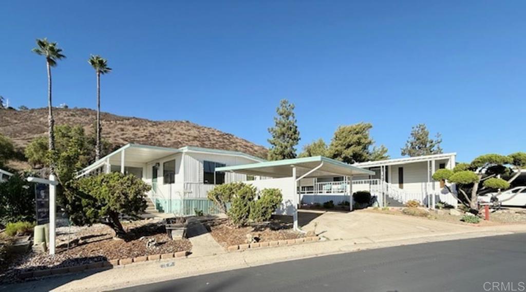 This is your opportunity to own in San Diego County under $200,000! The spacious and bright home is located in the coveted 55+ Pepperwood Park Community! The home features brand newer water heater, newer furnace, LVP flooring throughout, brand new kitchen with shaker cabinets and silver hardware, brand new dishwasher and stove, newer bathroom in hallway, newer carpet in bedrooms, sunroom and exterior steps, and new interior and exterior paint. Carport is located in front of home for covered parking. Space rent is $1,313 and trash service is billed separately. Community features beautiful club house, pool, spa/hot tub, and lush, green and mature landscaping. Located near shopping, restaurants, entertainment and close to freeway access for easier commute times. This is your chance to call this perfect cozy retreat home today!