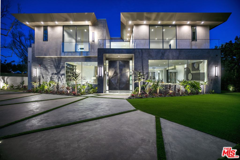 Fully furnished and exquisitely finished modern yet warm home built with entertainment and family in mind. The 10,750 sqft, 8 bedroom, 12 bathroom mansion sits on over 22,000 sqft of private land. There is no shortage of amenities with a 7.1 Movie Theater, fully equipped Gym, Half Court Basketball Court, Pool, Bar, Elevator, State of the art kitchen, secondary kitchen with outdoor Barbecue, and 2 glass enclosed temperate-controlled wine display. The master suite features beautiful his & her master bathrooms, incredible walk-in closets, massage room, & its very own bar to entertain their guest on the 2nd floor deck only a few steps away. The location is ideal as it is walking distance to Restaurant row on Canon Dr, trendy coffee shops, and world renowned Rodeo Dr.