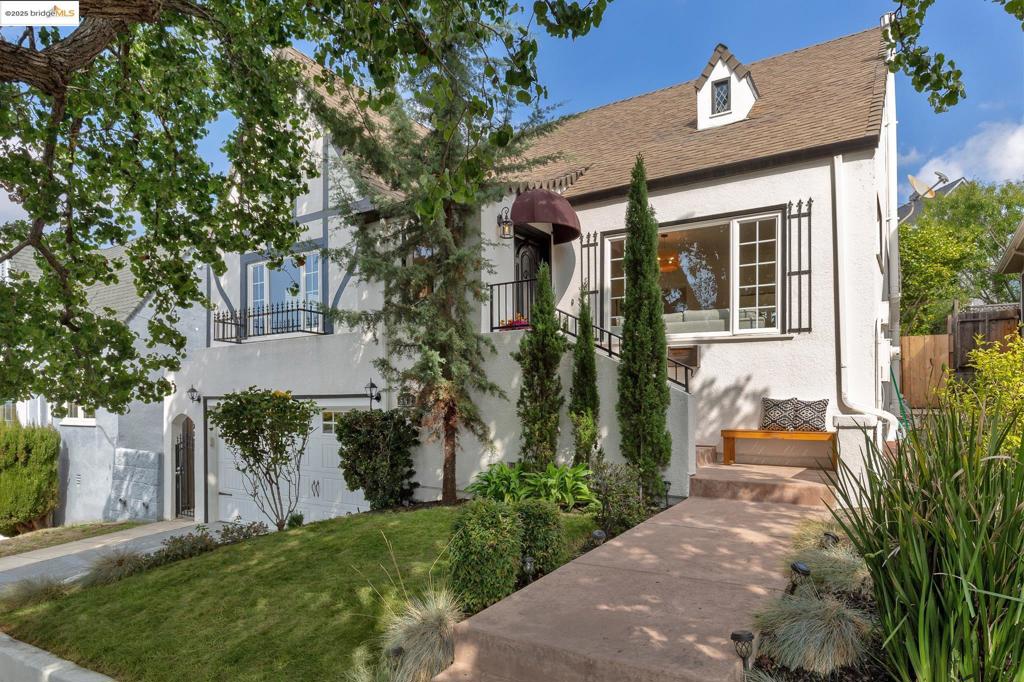 Located on a tree-lined street in the desirable Crocker Highlands neighborhood, this enchanting storybook Tudor combines timeless period charm with modern updates. The lovely home features an inviting light-filled living room with a large picture window & fireplace & a formal dining room that connects seamlessly to the thoughtfully renovated kitchen. The gorgeous chef’s kitchen boasts vaulted ceilings with skylights, beautiful cabinetry, warm walnut wood butcher block countertops & high-end appliances. Adjacent to the kitchen you will find a flexible bonus room that could be used as an office with doors that open to the delightful garden. The level-out garden features a large deck perfect for entertaining family & friends, a lawn area, stone patio & veggie planter box! Two large bedrooms & two tastefully remodeled bathrooms including the primary en-suite complete this special home. The stylish primary suite provides French doors that open to the private garden. Additional highlights include refinished HWD floors throughout, a spacious laundry room, two-car garage with interior access & lots of storage. Primary location across from Crocker Elementary, close to vibrant Lakeshore Avenue shops & top-rated restaurants & Lake Merritt.This true gem is not to be missed!