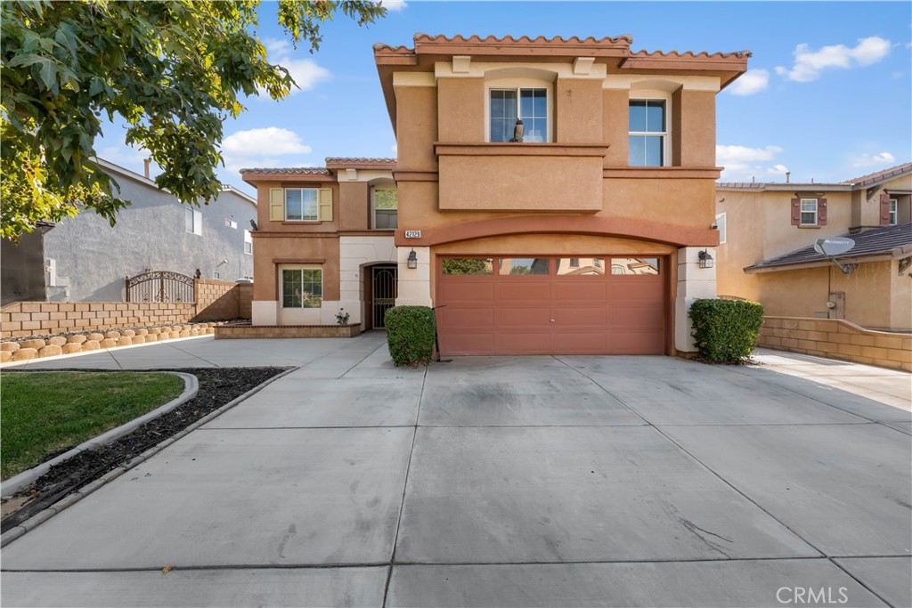 Beautiful two story Quartz Hill home. Step through double doors into a bright and open space flowing into the formal iving room and dining area.
The spacious family room with a fireplace connects to a gourmet kitchen featuring a large center island. The primary suite offers a doble vanity, jetted tub, and seperate shower. The backyard boast a covered patio with ceiling fans, stamped concrete and a built-in grill with bar.