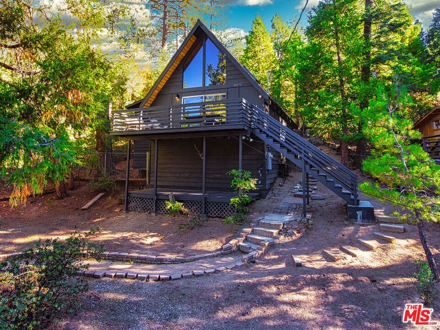 Perched high in the mountains this beautiful Pine Cove home is a rare gem. Good winter access via paved road and short driveway. This cozy rustic mountain A-Frame home offers 3 bedrooms-2 bathrooms with spacious tree top view deck. Pristine lot is just steps from the national forest. Features include hardwood & artistic marble floors, wood panel high beam ceiling, open countertop kitchen with stainless steel appliances, light & bright skylight living room with floor to ceiling windows, W/D unit inside. The Mini-Splits provide controlled heating/AC in all rooms for year round comfort. There is ample space for parking close to home entry. The top floor loft is cozy and special. This escape retreat home is absolutely perfect for all year-round mountain lifestyle.
