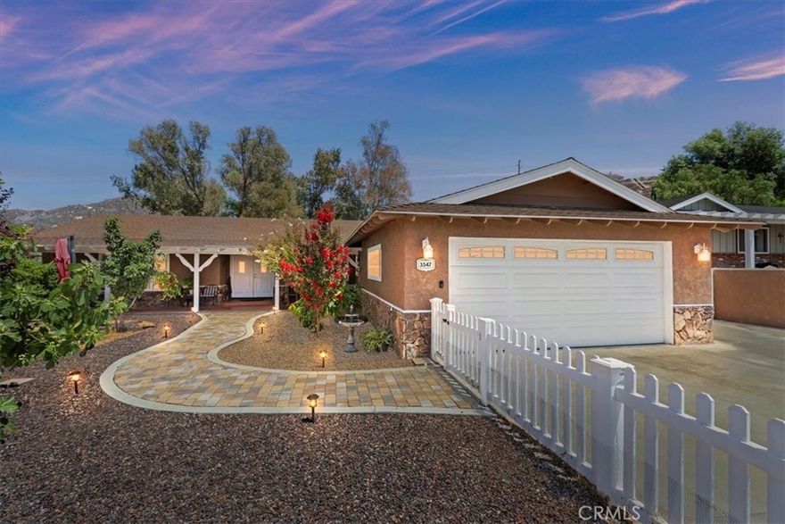 Fantastic location located in Old Norco just steps away From Ingalls Equestrian center, Pikes peak park, and Veterans memorial. Just a short distance to the Rodeo and all the Norco Events. This home has tons of curb appeal with beautiful white vinyl fencing that leads you into your courtyard full of fruit trees with beautiful pavers leading you the way to the front door. You get to sit on the covered front porch and relax and enjoy the nightly sunsets. As you enter through the double doors it will open up to an expansive open floor plan. Two family rooms with plenty of space to enjoy. The kitchen overlooks the secondary family room.  Kitchen has been upgraded with newer quartz countertops, newer pull down faucet,  and stainless steel appliances.  There is a free standing range that  has a convection oven, self cleaning and has high BTU's.  There is a secondary wall oven with a built-in microwave perfect for someone who loves to cook.  Natural real wood floor through-out the property.  The primary bedroom has French doors leading you to your back patio area where you can sit under the cover and enjoy listening to all the nature around you.  The primary bathroom has an oversized soaking tub that includes a shower sprayer.  The home has been upgraded with copper plumbing, new air conditioning and a whole house fan making cooling down the home much faster and easier.  The front yard features an array of mature fruit trees ready for you to enjoy each year & ready for your canning hobby.  The apple tree produces twice a year giving you the gift of tons of fruit and they are delicious. There are fig, pear, peach, avocado, apricot, lemon, pomegranate and pomelo trees. The backyard is set up for your own homestead that includes a chicken coop ready for you to bring your chickens and a shed is included.  The top portion is a perfect space for all your horses and animals and includes a greenhouse and raised vegetable planters .There are sprinklers &  drip systems for the entire property for all your growing needs. There are beautiful mature eucalyptus & pepper trees adding a country feel.  The upper level has a view of the city lights and mountains.  This property is steps from all the Norco riding trails on a quiet private street.  Room for Rv/horse trailer parking.  This home is a perfect floor-plan and location waiting for a new buyer to enjoy as the sellers have. Bring your horses, chickens, goats where there is plenty of room to build your dream equestrian area.