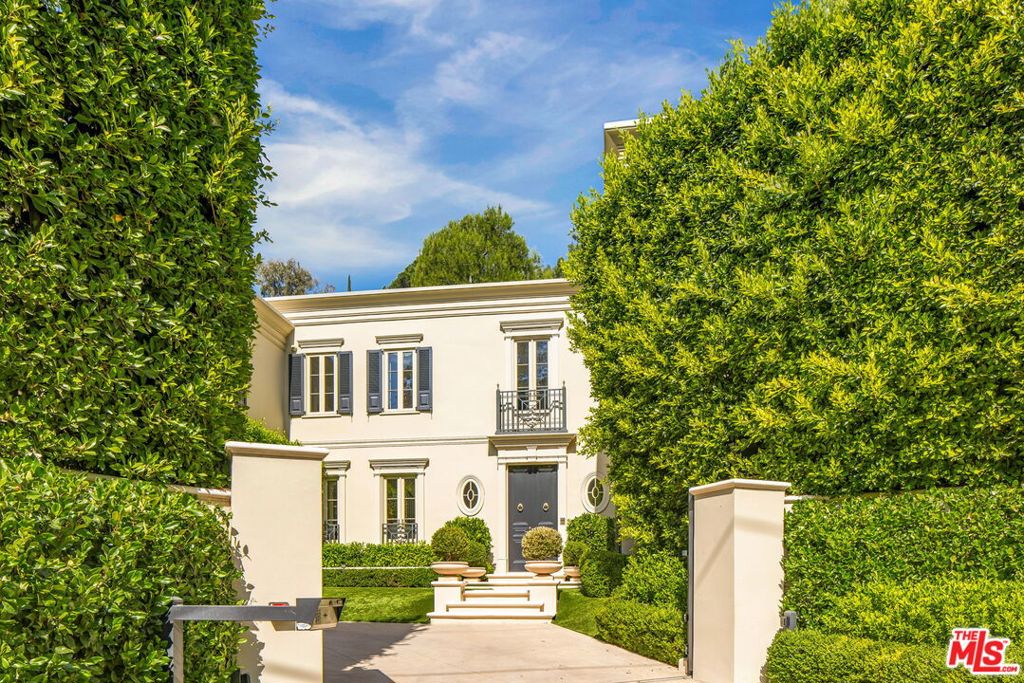 There is no parallel for the sophistication and style of this custom neo-traditional home. Accessed by a gated driveway, this two-story residence has been painstakingly reimagined by Thomas Pheasant (Dean of American Design, AD). Every corner reveals a new level of refinement and individuality. The circular entry leads to the living room and library on one side, and the dining room, kitchen, breakfast room, and family room on the other. Downstairs, wide-plank white oak floors set the tone. The living, library, and family rooms each feature a fireplace, while intricate crown and base moldings abound. Lacquered custom mahogany doors upstairs and down set a distinctive tone, and bespoke hardware elevates the interiors. Lighting has been thoughtfully designed to enhance art collections as well as evening moods. All exterior doors and windows have been replaced. The formal dining room overlooks the manicured rear landscape and opens to the kitchen, which is finished with inlaid marble floors and countertops, a custom La Cornue range, oven, and drawers. In addition to the refrigerator, freezers, and wine refrigerator, multiple refrigeration drawers are strategically placed for convenience. Adjacent to the kitchen, the breakfast room opens directly to the sunny pool area. From there, the family room and rear staircase complete the flow. A bespoke powder room finishes the main level. A graceful circular staircase leads to the second floor. The primary suite spans one side of the home, with a sitting room, large bedroom with fireplace opening onto to a private terrace, and two elegant bathrooms with heated stone floors. One bath features a freestanding tub, vanity, makeup station, and shower. The other offers a steam shower and office area. Abundant closet space completes the suite. On the opposite wing are two additional bedrooms, two bathrooms, and a large laundry room. The rear grounds are exceptionally private, with an oval swimming pool and spa surrounded by a limestone terrace, English-style gardens, a fountain, and winding paths. A two-car garage and auto carousel allow vehicles to turn easily toward the departure area. Very rarely does a property achieve such a consistent level of detail and restraint. 2401 Bowmont is a home of true sophistication, designed for the most discerning buyer.
