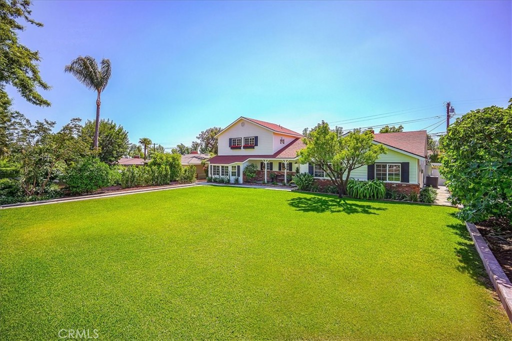 Fabulous 5br 3.5 bath remodeled home on prestigious Euclid Ave, with multi generational layout! This incredible home is bursting with charm and sophistication... from the expansive front lawns to the black and white farm house style, with inviting front porch, this property is sure to please! The interior showcases gleaming hardwood flooring, an updated gourmet dream kitchen, complete with stainless appliances, quartz counters, walk in pantry and grand center prep and seating island opening to the great room with contemporary fireplace, dining area and panoramic wall of windows looking out to the resort worthy back yard! The single level North wing showcases three spacious bedrooms and two full baths, including the secluded primary with walk in closet, french doors leading to the back yard, and attached en-suite with jetted soaking tub, dual sink vanity and separate glass enclosed shower. The South wing main level has an oversized bonus room with enormous walk-in closet, full sized laundry room with built in storage, and stylish half bath. The upper level has two generously sized bedrooms and a full bath, making it the perfect second family living space, or teen quarters! The private back yard is perfect for both entertaining and relaxation, with the sparkling pool, lush lawns, mature shade and fruit trees, covered patio, brick fire ring and long gated drive with alley access, flanked by block walls, with room for an RV. The two car garage, close proximity to shops and dining, excellent Upland schools, and prized location on Euclid Ave. make this the perfect place to call home! Tax rolls show 2546 sq. ft. appraiser measured 2966 sq. ft.