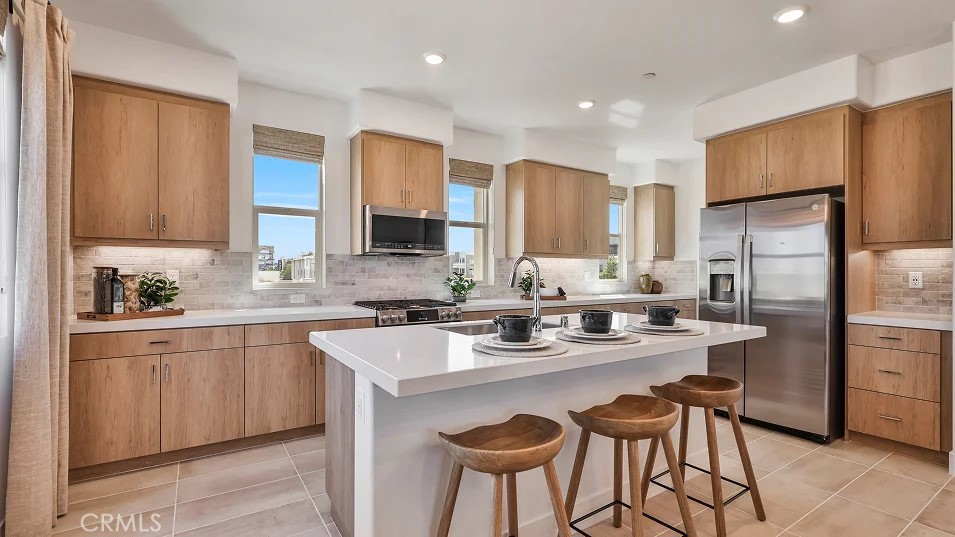 Gorgeous brand new, 4-bedroom end unit offers plenty of light with windows on three sides and only one shared wall. Bedroom and full bath on first floor. Huge great room, expansive modern kitchen with pantry, white shaker style cabinetry, white quartz countertops and stainless steel GE appliances including the refrigerator. Oversized kitchen island/breakfast bar. Impressive owner's suite with generous walk-in closet, dual sinks and a big shower. Upgraded flooring package included that offers Luxury Vinyl Plank throughout main living area and an upgraded carpet in bedrooms. Full laundry room.