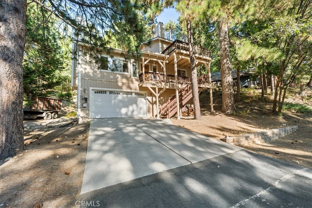 Assumable Loan at 2.375% — $297K Balance!
This inviting mountain home is tucked in a quiet cul-de-sac—peaceful, yet commuter-friendly, and just a short drive to Snow Valley Ski Resort, Lake Arrowhead, and National Forest land. With a new roof and new flooring throughout, this home is move-in ready with plenty of opportunity to make it your own.
The main level features an open floorplan with two spacious bedrooms, a full bath, and a bright kitchen/dining area that flows seamlessly to the deck—perfect for soaking in the fresh mountain air. The living room is the heart of the home with vaulted ceilings and a striking stone fireplace that creates warmth, charm, and character.
Upstairs, the private master suite offers its own brick fireplace, walk-in closet, and a deck with tranquil mountain views—a perfect retreat after a day of adventure.
Downstairs you’ll find a convenient laundry room, build-up storage, and direct access to an oversized two-car garage complete with a workbench and extra space for tools, hobbies, or all your mountain gear.
This is a solid, well-situated mountain home with character, comfort, and unbeatable financing options. Seller is motivated—don’t miss this rare opportunity!