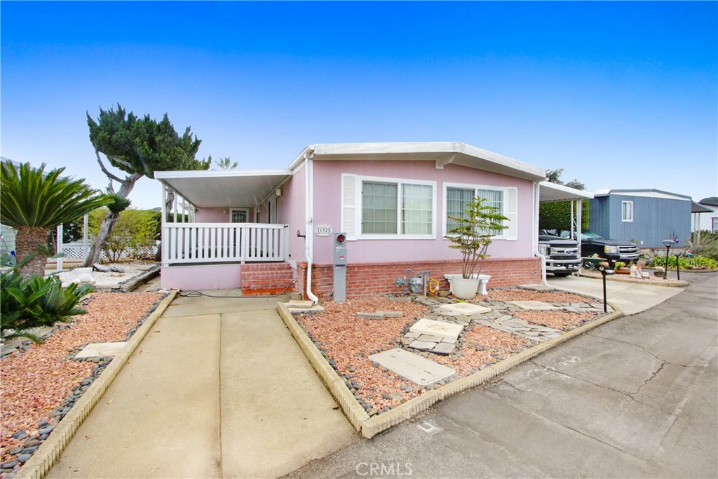 BEAUTIFUL 3 Bed -2 Bath Double-Wide in The Fountains Mobile Home Park (55+) This Home has been Completely Remodeled and is Move-In Ready. Wonderful North-Facing Property provides a Beautiful View of the San Gabriel Mountains! Big Picture Windows in the Living Room Provide Lots of Natural Light. An Open Floor Plan makes the Home feel Extra Spacious. The Lovely Remodeled Kitchen with Tile Flooring has Beautiful Countertops along with Ample Cabinets and Counter Space. (Appliances Remain). The Kitchen opens to the Family Room and Living Area, with Access to the Large Covered Front Porch. Laundry Inside Kitchen. 3 Bedrooms with the 3rd Bedroom off Master having its own Access from Front Porch offers many uses! Both Bathrooms have also been Remodeled with Tile Floors and provide Walk-in Showers for Convenience. When Home was Remodeled, New Insulation was Installed, along with Drywall, New Siding, and Dual Pane Windows. Home has a Metal Roof, Earthquake Bracing & Newer Water Heater.
The Fountains Mobile Home Park is a Well-Managed 55+ Park with Many Wonderful Amenities for the Residents to Enjoy! Large Clubhouse with Banquet Room, Many Social Activities, Pool, Jacuzzi, Shuffleboard, Gym & Dog Park. Come See this Beautiful Home and Enjoy this Wonderful Community! This (Home is on REGISTRATION!- Spc Rent: 1520.)