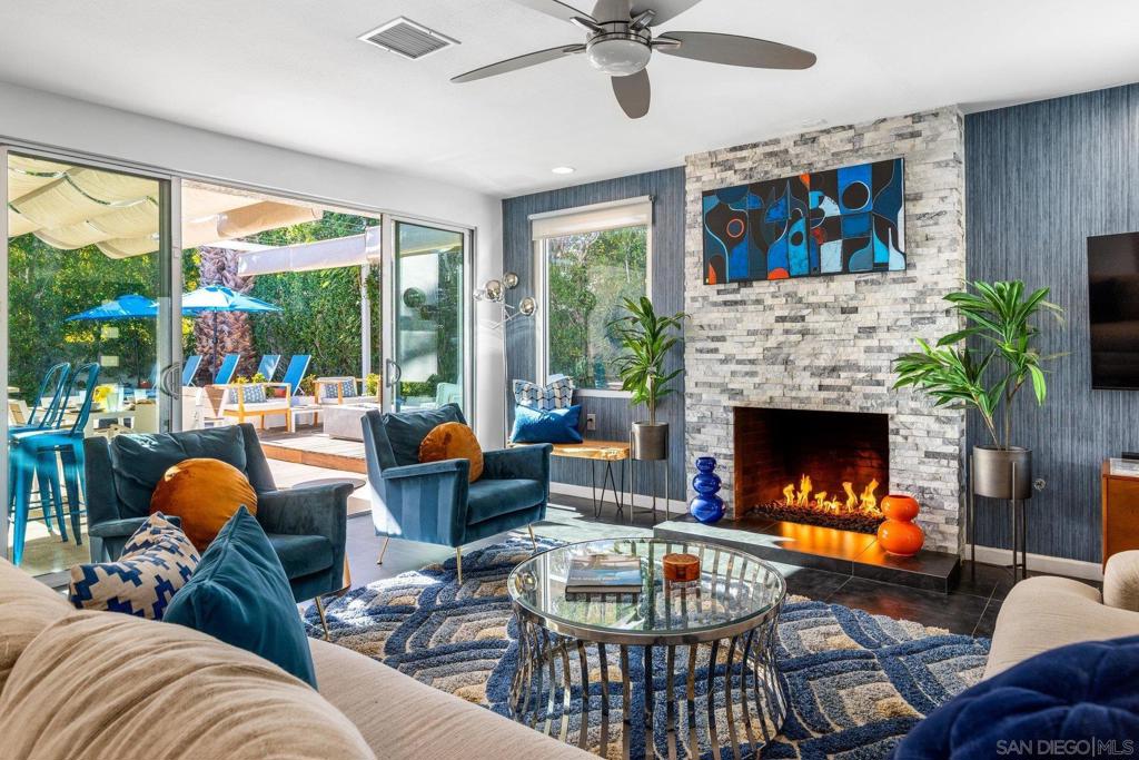 "Desert Sapphire" ~ Voted "Guest Favorite" on Airbnb, this highly lucrative vacation rental is turnkey and offered fully furnished with over $100,000 in upgrades and consistent track record of vacation rental history. Per City of Palm Springs, this home is eligible for a new STVR permit. A lush, art-filled oasis on the westside of the historic Racquet Club, just minutes from downtown Palm Springs and the Tram, the open, airy floor plan of the main house showcases playful, colorful, mid-century design. All bedrooms enjoy direct access to a shaded lounge area, saltwater pool, spa, fire pit, game area, and stunning San Jacinto mountain views. The separate, tropical-themed casita has an ensuite bath, large wood patio, and is perfect for some extra privacy from main house. Recent upgrades include newer smooth pebble-tec pool coating & pool equipment, custom Ipe wood decks, custom pergola, landscaping & irrigation, and smart home controls (pool, thermostat & locks). Privacy abounds as there are no neighbors on the back (South side) of the property and the large, serene yard is yours to relax and enjoy the sun and mountain views. Soak up the sun from the baja shelf or take a dip in the saltwater pool. The covered patio has outdoor dining for 6 and a built-in gas BBQ grill, with custom shade structure. Lounge seating on the raised Ipe wood deck surrounds a modern gas firepit & seats 7+, and there are multiple chaises for relaxing by the pool. The shaded game courtyard includes ping pong and additional lounge seating, and lighting for night-time play. The living room has a gas fireplace, 58" Roku smart TV, plenty of board games, an oversized sofa, and large sliding doors that not only allow easy access to the pool – but also let in abundant natural light. The modern kitchen, with stainless appliances and quartz counters, is fully stocked with everything you could possibly need to cook and serve meals including a breakfast bar and adjacent dining area. THE POOLSIDE ROOM - Adjacent to pool, spa & cabana with mountain views. Large sliding doors & lots of natural light. King bed & walk-in closet. 43" Roku smart TV. Memory foam mattress & luxury bedding. CASITA TROPICALE - Private suite with separate locked entrance and exclusive Ipe wood patio w/seating & views of the mountains. Ensuite restroom. King bed with memory foam top. Lounge area with large sofa, laptop table and reading lamp. 43" Roku smart TV. Armoire for storage. THE AGATE ROOM - Central to the home & adjacent to outdoor game courtyard & pool. Queen bed with memory foam mattress & luxury bedding. Large dresser. 50" Roku smartTV. THE GARDEN VIEW ROOM - Large, private suite with personal restroom and access to outdoor game and pool area. Views of front garden. Queen bed with memory foam mattress & luxury bedding, 50" Roku smart TV. Armoire for storage. The Racquet Club West neighborhood is one of Palm Springs’ most iconic areas, blending mid-century modern architecture with a laid-back desert lifestyle. Known for its rich history and proximity to downtown Palm Springs, it offers easy access to the city’s best dining, shopping, and entertainment. Past booking revenue reports available upon request, This home has solar power (Sunrun).