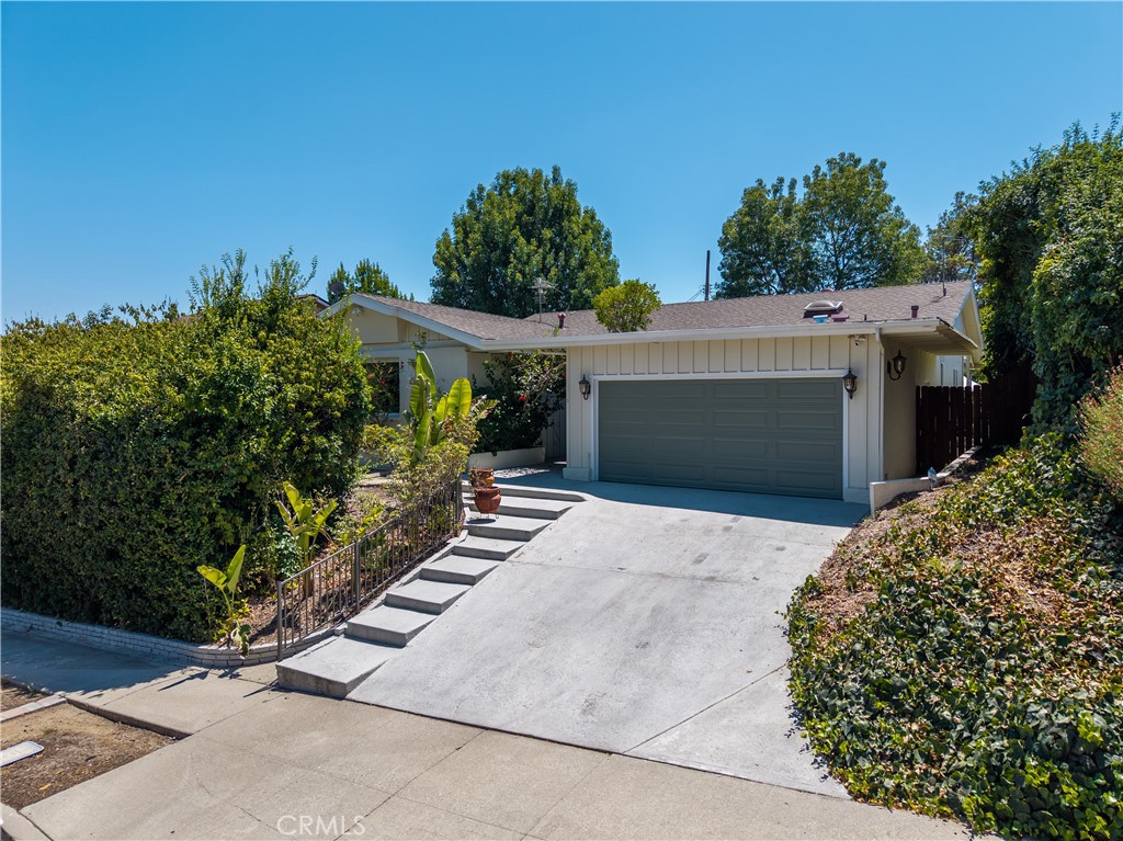 Tastefully remodeled gem in the heart of Granada Hills, this 3-bedroom, 2-bathroom home offers 1,833 sq. ft. of bright, open living space on an inviting 8,510 sq. ft. lot. The modern kitchen showcases sleek cabinetry, updated appliances including a 36-inch 6-burner stove, copper kitchen plumbing, and a seamless flow into sun-filled dining and living areas framed by recently replaced windows. The spacious primary suite features a private en-suite bath, while the additional bedrooms provide comfort and flexibility for family, guests, or a home office.
Notable upgrades include a brand-new AC system (2024), new electrical panel, permitted earthquake retrofit, and an automatic sprinkler system for easy maintenance.
Step outside to a backyard with a sparkling pool (new pool pump 2024), landscaping, and a covered patio with a BBQ area—perfect for entertaining or unwinding in style. Located within the boundaries of top-rated schools and just minutes from parks, shopping, dining, and easy freeway access to the 118 and 405, this home offers the perfect blend of comfort, style, and convenience.