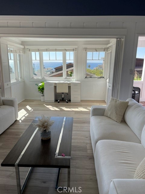 Step into timeless Laguna Beach charm with this beautifully preserved 1947 vintage cottage, perfectly situated in one of the area’s most desirable and picturesque neighborhoods—just a short walk to iconic Victoria Beach, home to the famed Pirate Tower and stunning tidepools. You’re also within walking distance to the world-renowned Montage Resort and the beautifully landscaped oceanfront paths of Treasure Island Park.
This stand-alone, single-level residence offers two bedrooms and two bathrooms across approximately 1,150 square feet of refined coastal living. Thoughtfully maintained, the home features a fully equipped kitchen, sun-drenched interiors, and seamless indoor-outdoor flow to a panoramic ocean-view front patio—an ideal setting for morning coffee or golden hour gatherings. The private backyard provides a serene escape with captivating views of the ocean, city lights, and surrounding hills.
The primary bedroom is appointed with a king-size bed, and the property includes a one-car garage with private laundry. Offered furnished or unfurnished, with furnishings negotiable, this rare offering combines classic beach cottage charm with a relaxed yet luxurious lifestyle in the heart of Laguna Beach.
