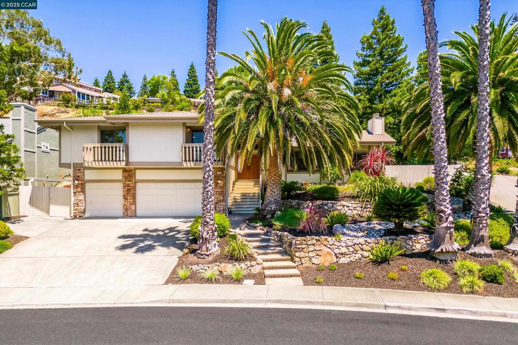 Open Sunday 2-4! Pleasant Hill's BEST BUY! Boasting a Mid-Century vibe, this fabulous home is located on cul-de-sac and offers 2,840 square feet of meticulously crafted living space, where style meets everyday comfort. Host unforgettable gatherings in the expansive living room, featuring a wet bar and conversation pit with fireplace. The open kitchen, seamlessly connected to a casual dining area, flows into the family room and extends to an elegant formal dining room—perfect for both lively celebrations and serene family dinners.The family room, featuring its own inviting fireplace, opens directly onto the backyard, merging indoor comfort with outdoor enjoyment. Need a flexible workspace? The dedicated office with its private deck is your answer. Discover the bedroom wing, where four bedrooms await, including a primary suite with an ensuite bathroom and walk-in closet. With an additional hall bathroom and half bath, everyone’s comfort is ensured. A spacious three-car garage and a practical laundry room add to the home’s convenience. Outside, the expansive 11,900-square-foot lot beckons you to relax, garden, enjoy meals under the stars, or simply play. Experience the perfect blend of sophistication and functionality at 220 Devonshire Court—a home that truly has it all!