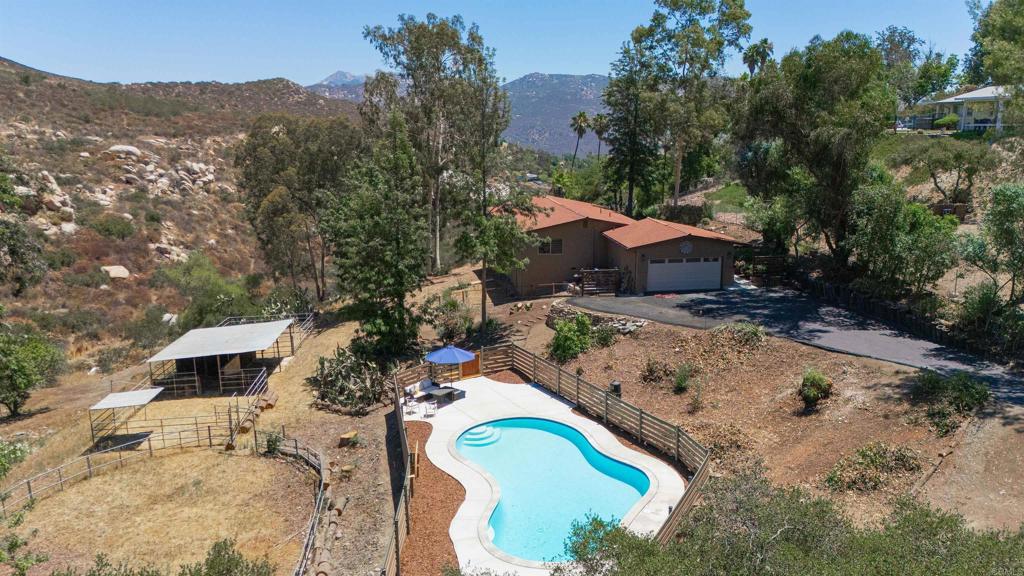This unique and private hilltop retreat is nestled amongst the trees on the very top of the enchanting Eucalyptus Hills neighborhood. It offers a secluded setting yet remains close to the freeway for easy commuting. Next to an open space preserve, the property provides stunning 180-degree views, seasonal creeks, and abundant wildlife nearby. This single-story 4 bedroom 2 bath features nearly 2,000 sq ft of living space on a 1-acre, tree-lined lot. Completely remodeled in 2023, this home enjoys a complete interior and exterior paint job and a newly remodeled pool with new pool fencing. In addition in 2023, a new roof and HVAC system with ducting was installed. Garage was recently finished with drywall & insulation and the floor was epoxy coated. This one-of-a-kind hideaway is guaranteed to give peaceful, easy feelings to its new owners.