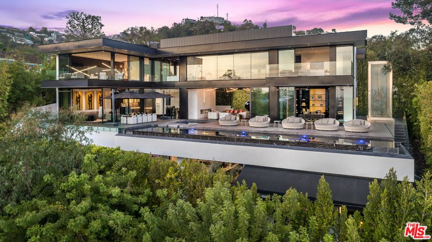 Enter the sexiest Sunset Strip modern and privately-gated compound ever conceived, offering seductive city views of the worlds most glamorous city, selling both dreams & a lifestyle. Walking distance from ground zero of the Sunset Strip, and the finest dining and entertainment LA has to offer, we have the most discerning compound, immaculately finished with every detail accounted for, and every facet of the home controllable with the sophisticated control4 Savant System. Offering dramatic architecture, soaring 30-foot ceilings rise above Italian Sahara stone floors, encasing the ultimate living space. Featuring first-class accommodations, from your very own spa wellness retreat with a cryo chamber, hot yoga and salon, a full-size movie theater and six sumptuously appointed bedrooms. Dont miss your chance to experience your wildest dreams at thirteensixty9- Londonderry PL- offering nothing short of elevated living, meticulously designed and built for my lavish entertainers.