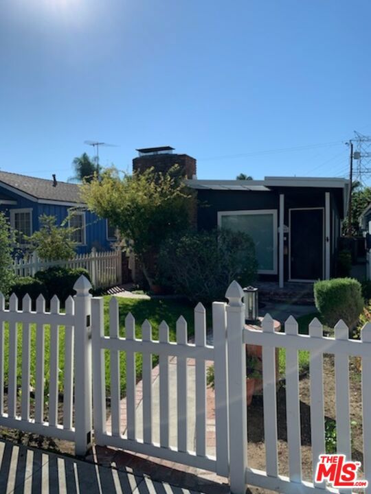 Newly remodeled home on the Chandler bike path! This 2BR/1BA home has been lovingly remodeled top to bottom. Brand new kitchen with new wood cabinets, new Samsung stainless steel appliances, new quartz countertops, farmhouse sink, and modern hardware. New bathroom with cast iron soaking tub, subway tile shower, new toilet & vanity, modern tile floor, and added storage space. High angled ceilings, brand-new hardwood floors and new Anderson windows throughout the house. Newly updated fireplace with new reclaimed wood mantle & new tile hearth. New recessed lighting in living/dining room, new designer interior & exterior light fixtures throughout. New door casings & baseboards, and fresh interior & exterior paint throughout. New 1-car garage door & brand-new washer & dryer in garage. Brand new plumbing throughout, new sewer line, & new tankless hot water heater. Charming & lush front yard with lawn, and back patio ready for enjoying California evenings! Close to Studios, trendy shops and restaurants, parks, recreation, hiking and bike paths. A true Burbank Beauty.