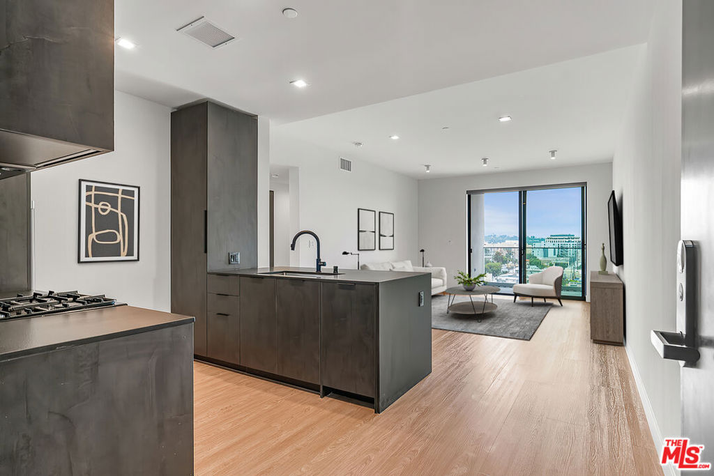 Venue Residences by Helio. This beautiful corner 2 bed + 2 bath is on the top (8th) floor, with South facing views. Kitchen has unique dark finishes with stained granite counters, matte black fixtures, and stainless steel Beko appliances. The open living and dining concept allow for a good flow of the space, with a built-in dining counter for barstools, as well as access to a large balcony for comfortable outdoor lounging. The bedrooms have custom built-in closets, wall mounted lighting and a remote controlled ceiling fan. Bathrooms have large mirrors, shower/tubs, and under cabinet storage. Residence also includes custom electronic window shades, smart lights, and Nest thermostats. Amenities include 2 rooftop lounges, fitness center with techno gym equipment, heated dipping pool, co-work spaces and front desk staff. Parking is $250/month for a tandem space, and internet $84/month. Contact us today!