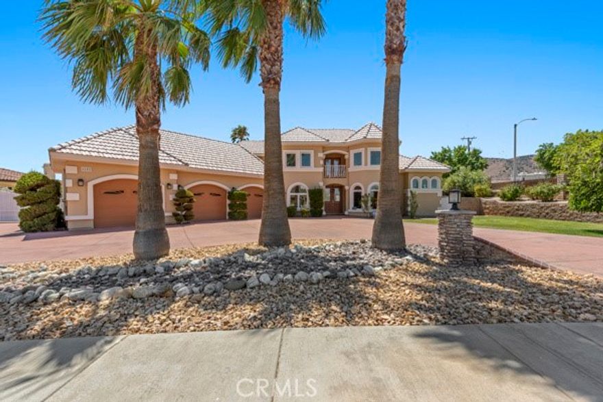 Stunning Custom Estate in a Sought-After Neighborhood on a Premium Lot with Panoramic Views! This fully customized home offers a grand entrance with vaulted ceilings and a dramatic marble staircase. The spacious floor plan includes a downstairs primary suite, while upstairs you’ll find three large bedrooms—each with its own private bathroom and balcony. A bonus room/office provides additional flexible living space. Enjoy a chef’s kitchen with abundant cabinet and pantry storage, a custom study/office, and a formal dining room perfect for entertaining. 

The designer backyard is a true showstopper: enormous RV access with an automatic gate, 220V hookup, and dumping station, plus a large enclosed patio, built-in BBQ, and a sparkling custom pool and spa with waterfalls and breathtaking mountain views. In addition to an unpermitted garage unit with one bedroom, the property also features a workshop that has been converted into a private bedroom apartment, separate from the main house—ideal for guests, extended family, or rental income potential. The oversized 3-car garage offers enough room for a car lift and all your toys. This is the kind of property that rarely hits the market—schedule your showing today!