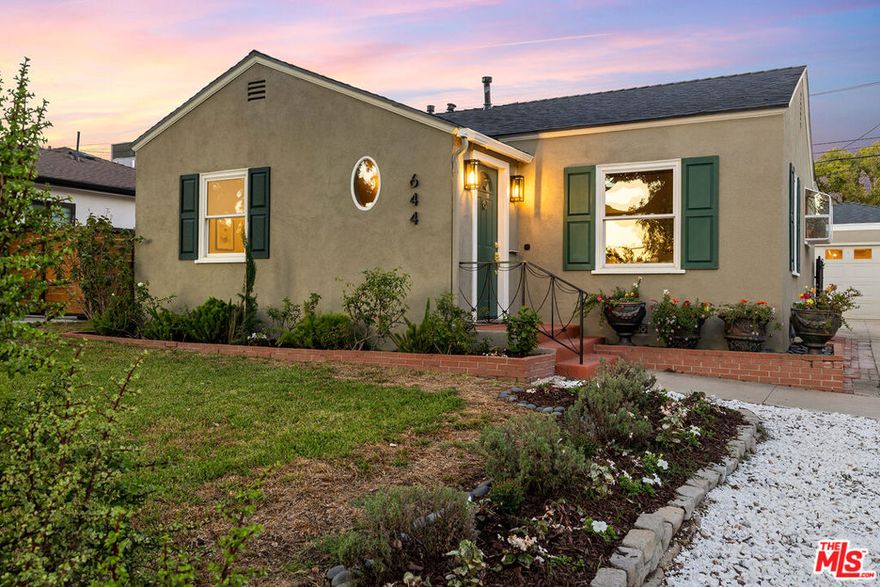 Just shy of Warner Brothers and the Magnolia Park shopping district, 644 N Screenland is the idyllic Burbank Traditional you've been looking for. This cozy home offers both a formal living room and a well-appointed den, in addition to a detached bonus space perfect for a home studio, home office, or generous home gym. A covered outdoor patio is fit for entertaining with views of the rose garden, and the kitchen is stocked with a top-of-the-line Miele oven and range. The bathrooms are lined with custom marble and tile, and the primary bath features a spa shower and Venetian plaster. Updates to the home include a new sewer line, solar panels, a new electrical panel, and built-in speakers in the studio. This quiet block is home to a tight-knit community that hosts Halloween and Easter events with the most active participation in the neighborhood.