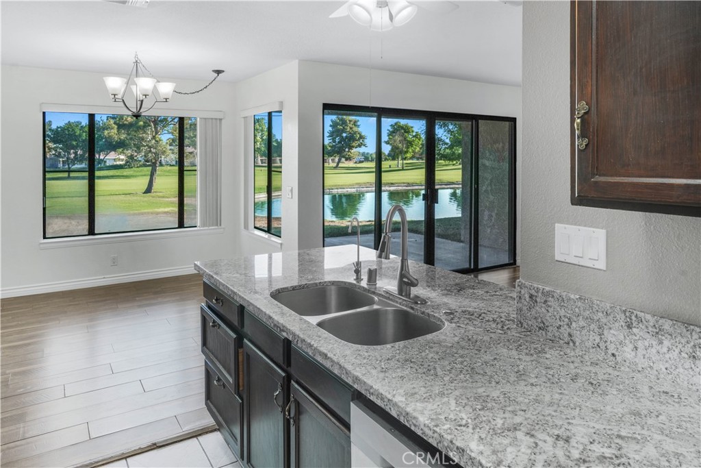Welcome home! Located inside the private community of the Fairway Courts Condo complex, this condo gives you access to a variety of wonderful amenities and a spectacular view, giving you and your family the perfect vacation home. As you drive into the community you immediately notice the condo sits right in front of the Lake and the golf course. Equipped with a two-car garage, as you enter the home, you see that it has been renovated to give you that modern feel. The living room has an open concept, and you can see the home is furnished with beautiful laminate flooring and a relaxing view to the lake. Walk into the kitchen and you notice the granite counter tops, the under mount sink, and the polished cabinets. Stepping into the hallway heading to the two bedrooms, you will see the bathroom has been renovated with granite countertops and fashionable light fixtures. Adjacent to the bathroom is the first cozy bedroom with laminate flooring. Walk into the spacious master bedroom and see that it contains your very own walk-in closet and contemporary master bathroom. As if this beautiful home wasn’t enough, head to the covered patio and take in the soothing scenery. With the membership to the Silver lakes association, you have access to, but not limited to, the golf course, tennis courts, clubhouse, gym and swimming pool and heated spa. You can also go fishing in the lake and have RV access. So, grab your golf cart or your boat and call today.