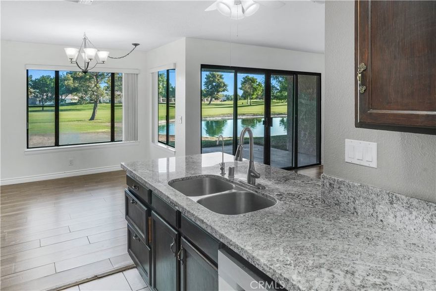 Welcome home! Located inside the private community of the Fairway Courts Condo complex, this condo gives you access to a variety of wonderful amenities and a spectacular view, giving you and your family the perfect vacation home. As you drive into the community you immediately notice the condo sits right in front of the Lake and the golf course. Equipped with a two-car garage, as you enter the home, you see that it has been renovated to give you that modern feel. The living room has an open concept, and you can see the home is furnished with beautiful laminate flooring and a relaxing view to the lake. Walk into the kitchen and you notice the granite counter tops, the under mount sink, and the polished cabinets. Stepping into the hallway heading to the two bedrooms, you will see the bathroom has been renovated with granite countertops and fashionable light fixtures. Adjacent to the bathroom is the first cozy bedroom with laminate flooring. Walk into the spacious master bedroom and see that it contains your very own walk-in closet and contemporary master bathroom. As if this beautiful home wasn’t enough, head to the covered patio and take in the soothing scenery. With the membership to the Silver lakes association, you have access to, but not limited to, the golf course, tennis courts, clubhouse, gym and swimming pool and heated spa. You can also go fishing in the lake and have RV access. So, grab your golf cart or your boat and call today.