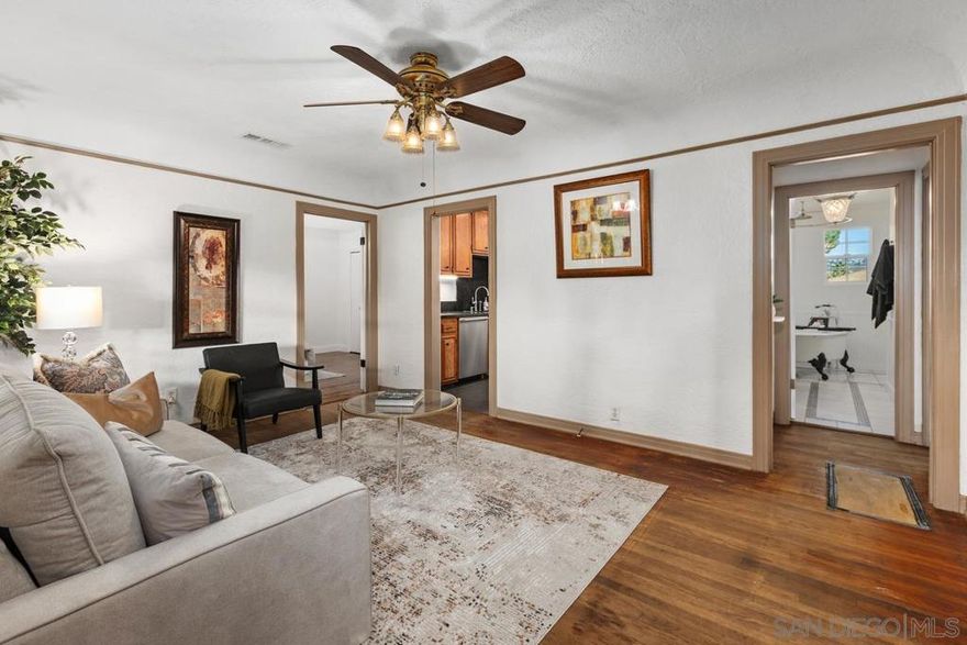 Welcome to this charming 97-year-old gem in Spring Valley (proof that they really don’t build them like they used to)! This 3-bedroom, 2-bath starter home comes with all the essentials you need, and a few fun surprises. Cove ceilings grace the living area. The kitchen features sleek stainless-steel appliances paired with Italian porcelain tile that’s fancy enough to make you say “buongiorno” while you make your morning coffee.  Sure, she could use a little TLC here and there, but don’t worry...most of the big-ticket items are already taken care of: newer roof, updated tankless water heater, all new plumbing with copper water lines (yes, all of it), sewer line to street replaced w/ ABS and clean-outs installed, and fresh paint inside and out, updated bathrooms and kitchen, outdoor shower. All but 3 windows have been replaced.   Enjoy a fully fenced yard, a private backyard retreat with a covered patio, and, because you deserve it, a fully functional jacuzzi waiting for you to unwind in. The remodeled primary bath is ready to impress, and the hall bath features a stunning claw-foot tub that practically begs for bubbles and a glass of wine.-----  Got toys? The extra-long driveway with a double gate is perfect for secure RV or truck parking.  This fantastic starter home has great bones, modern updates, and plenty of personality. Come give it the little love it needs — it’s ready to love you back!