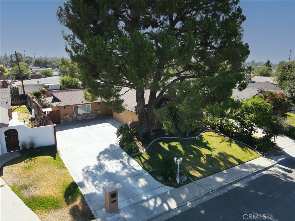 Charming Home with Bonus Room, Pool & Owned Solar. You'll fall in love with this updated 3-bedroom, 1.75-bath home featuring a versatile bonus room and a sparkling pool. Recent upgrades include some newer flooring, Newer: light fixtures, plantation shutters, fresh paint, and an updated guest bathroom. The inviting living area offers a fireplace and flows into the formal dining space. The lovely kitchen boasts some stainless-steel appliances, while the spacious bonus room perfect for a game room or entertainment space opens directly to the backyard for easy indoor-outdoor living. With owned solar, this home is as efficient as it is beautiful