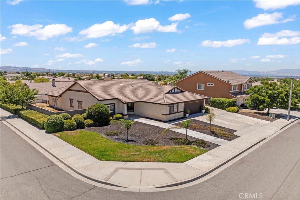 Welcome to this single-story gem nestled on a spacious corner lot in desirable East Highland. This versatile 4-bedroom, 2.25-bath home offers exceptional flexibility with a bonus room that can serve as a primary retreat, den, or a 5th bedroom—perfect for growing households or multi-generational living.
The expansive primary suite features dual walk-in closets and a spacious layout with retreat potential. The open-concept kitchen and dining area seamlessly flow into the living spaces, while a permitted family room addition with 1/4 bath adds even more space to relax and entertain. Plans for all additions are available on-site.
Enjoy year-round comfort on the covered patio complete with an electric fireplace—ideal for cozy evenings or summer gatherings. Additional highlights include a separate indoor laundry room, ample RV parking, and the convenience of a corner lot location.
Don’t miss your chance to own this move-in ready home with room to grow, entertain, and thrive.