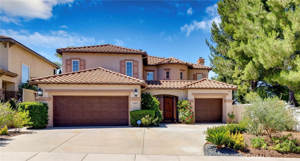 STUNNING HOME WITH AMAZING VIEWS AND TRANQUIL CUL-DE-SAC! Discover the perfect blend of comfort and breathtaking scenery in this exceptional 4 Bedroom, 3 bath home. From the moment you arrive, the home's captivating curb appeal and welcoming courtyard set the tone for the warm atmosphere inside. Step through the front door into a spacious living area filled with natural light, custom flooring, and high ceilings. The versatile main floor bedroom offers the flexibility to serve as a home office or guest suite. Seamlessly connected, the inviting family room has updated carpeting, large windows that fill the room with natural light, and a cozy fireplace that radiates with charm. The kitchen is the heart of the home, generously sized with double ovens, large island, and plenty of counter and cabinet space. The kitchen opens up to the dining area and family room with another inviting fireplace, perfect for cozy evenings. Upstairs, you'll find a spacious loft and large primary suite, which has raised ceilings and amazing views of the valley. The en-suite bath is a serene escape with marble countertops, soaking tub, shower, and walk-in closet. There are two additional upstairs bedrooms with one generously sized, that can be a large gym, playroom, or creative space. Outside, enjoy the privacy and serenity of your backyard retreat, ideal for outdoor dining, relaxing, or simply enjoying the stunning hillside and sunset views. Located in the highly desirable Temecula Valley Unified School District and Great Oaks High School, and just a few minutes from shops, dinning, Redhawk Golf Course, Old Town Temecula, and world class wineries. This home offers both style and comfort, and is a place where lasting memories are waiting to be made!