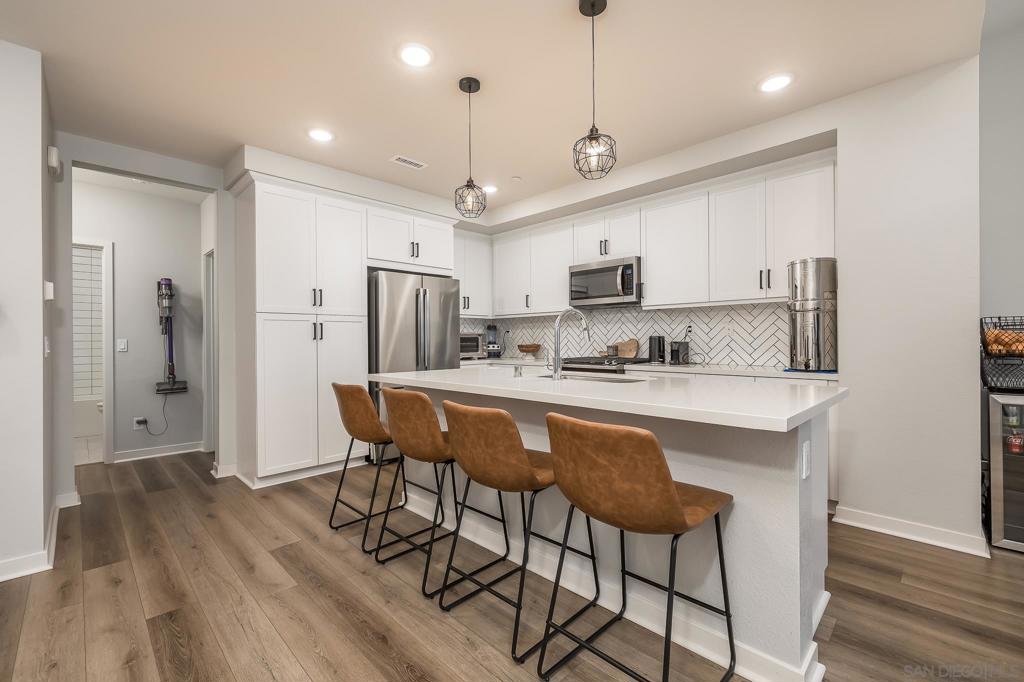 Absolutely BRAND NEW home. Built in October and can be yours today! This 3 bed, 3 bath townhome still has that new house smell. On the first floor you'll find a bedroom and full bath with 2 car garage. The entry serves as wonderful mudroom with fresh LPV flooring throughout. Premium carpet lines the stairs, leading up to the open concept kitchen and living room. High ceilings, shaker cabinets and quartz counters with a massive center island make this an entertainers delight. VA approved, WON'T LAST! Sellers bought this home in October of 2020 and have to relocate. Their loss is your gain. This home is still under warranty! Stainless steel appliances and top of the line washer and dryer convey. This is a fabulous new construction community in the heart of Eastlake's winding walk community. Tons of local shopping, amenities, bike lanes and walking trails. Years of value await with very low fees and lots of amenities. The home feels like a single level home with a downstairs bed and bath in law suite. The master bed and guest bath are right off the kitchen and laundry room. There is a lovely balcony off the living room. You won't find a cleaner, fresher home anywhere on the retail market. FHA and VA approved, these homes are flying off the shelf. Complex Features: ,, Sewer: Public Sewer Topography: LL