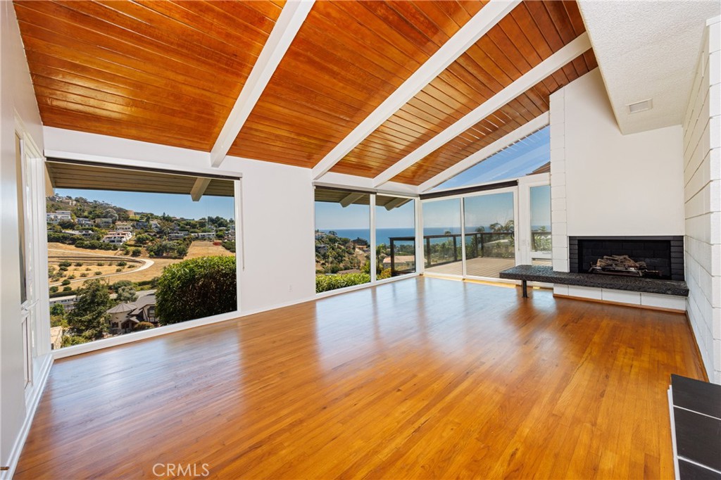 With fabulous ocean and canyon views, this single family home offers peaceful tranquility and privacy. Recently refreshed with new carpeting and paint, it is ready and waiting for its new tenants. This single-level property features two bedrooms, one and a half baths, and a fabulous living area with vaulted ceilings and panoramic views. A large ocean-view deck just off the living area is the ideal place to enjoy the views, entertain, create an outdoor dining experience or just relax. The over-sized two-car attached garage is an added benefit. Luxury and a quiet, comfortable living experience can be yours with this wonderful home. Laguna Beach is famous for its world-class beaches, art community, highly-rated schools and outdoor activities.