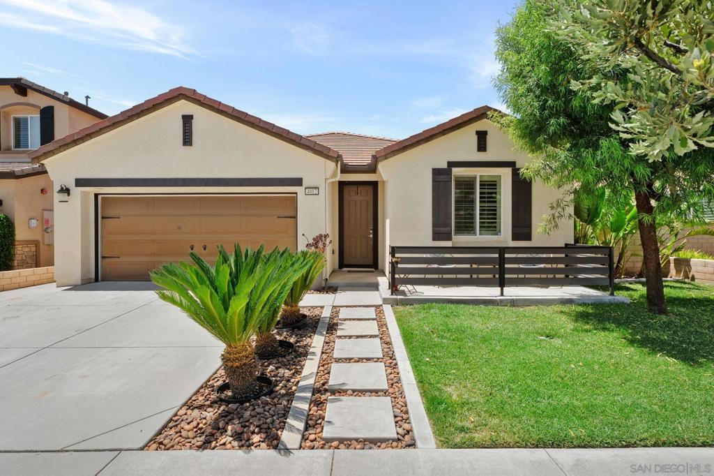 Welcome to this premier single-story move-in-ready gem nestled in the heart of the beautifully master-planned community of Rosena Ranch. Enjoy over 1,900 square feet of thoughtfully designed living space. Excellent curb appeal, complete with a welcoming front porch, and a full security system—including a Ring Video Doorbell. Step inside to a beautiful foyer that opens into a spacious open-concept kitchen and Great Room, perfect for both relaxing and entertaining. The kitchen showcases granite countertops, an oversized island with ample seating, and a walk-in pantry. Stylish natural-colored vinyl plank flooring flows throughout the home, complemented by 4-inch baseboards and elegant plantation shutters. The primary suite is thoughtfully separated from the secondary bedrooms and features dual vanities, a luxurious soaking tub, and a spacious walk-in closet. Step into the backyard retreat, where you'll find a custom concrete patio, motorized retractable awnings, a stacked stone fireplace with ambient lighting, and a beautifully designed retaining wall—ideal for evening relaxation or weekend gatherings. The two-car garage is a true standout, equipped with epoxy flooring, built-in storage closets, overhead storage racks with a lift system, a tankless water heater, and a Tesla wall charger. Solar energy powers the entire home, helping to keep energy costs low. Residents of Rosena Ranch enjoy year-round access to outstanding community amenities, including three sparkling pools, a splash park, a 24-hour gym, a sports complex, scenic trails, and regular community events.