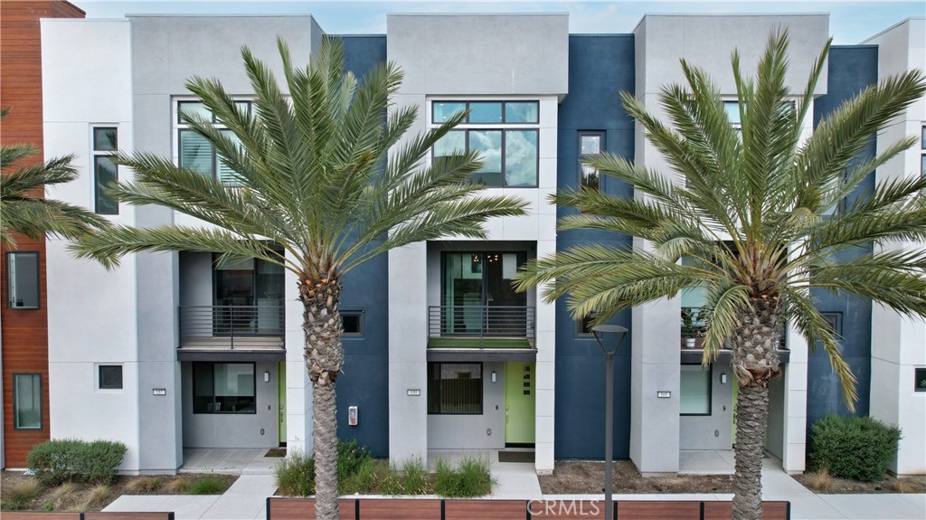 Welcome to this Beautiful three-story townhome that features 3 bedrooms, 2.5 bathrooms, and an Open Concept layout. This highly desired Fleet Residence 4 is located inside Levity at Tustin Legacy. The first floor is welcome you with the 2-bay garage. It includes plenty of storage and a large den featuring stunning wood look laminate flooring, Designer Light Fixture, a coat closet by the stairs and upgraded carpet leading up to the main home. The second floor enters into the gourmet kitchen, featuring a large center island, Amara Quartz Countertops, Tiled Backsplash, GE Profile stainless steel appliances, and slider doors to the covered deck. The kitchen opens into a spacious open-concept living area featuring a stone wall, designer light fixture, and a ceiling fan. Just off the dining room is the built-in linen storage and powder bath conveniently located. The third level features the large master suite featuring a walk-in closet and bathroom with a walk-in shower and dual vanities. There are also two secondary bedrooms and a full bath with dual vanities. Convenient upstairs Laundry Room and Energy Efficient Whole House Fan. Upgrades throughout include LED Recessed Lighting, Ceiling fans, and Designer Lighting. Tenants will also enjoy access to The Connection, a .6 acre community recreation facility featuring a swimming pool, spa. barbecues, showers, and restrooms. Smart Home Technology, Ring Doorbell, and so much more! Conveniently located near The District Shopping, Dining, and Entertainment. Do not miss this one!
