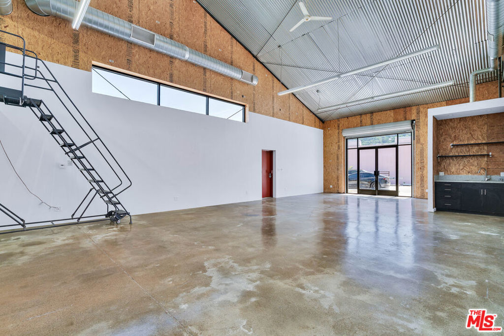 Located on the LA River in Elysian Valley's Frogtown district. This flex space offers 2 rooms, one bathroom, 2 parking spaces and private access to the LA River walk. Perfect for an artist studio or spacious private office.-EV Charger- Central cooling & heating- Polished concrete floors- Fridge- High ceilings Utilities (water, gas, sewer & trash) included. Electricity billed to tenant. One year lease. First month's rent and deposit due at signing. Smoking allowed outside.$5600 a month commercial flex space, multi year lease OK 1500SF plus extra loft space,125AMPS 3 phase,
