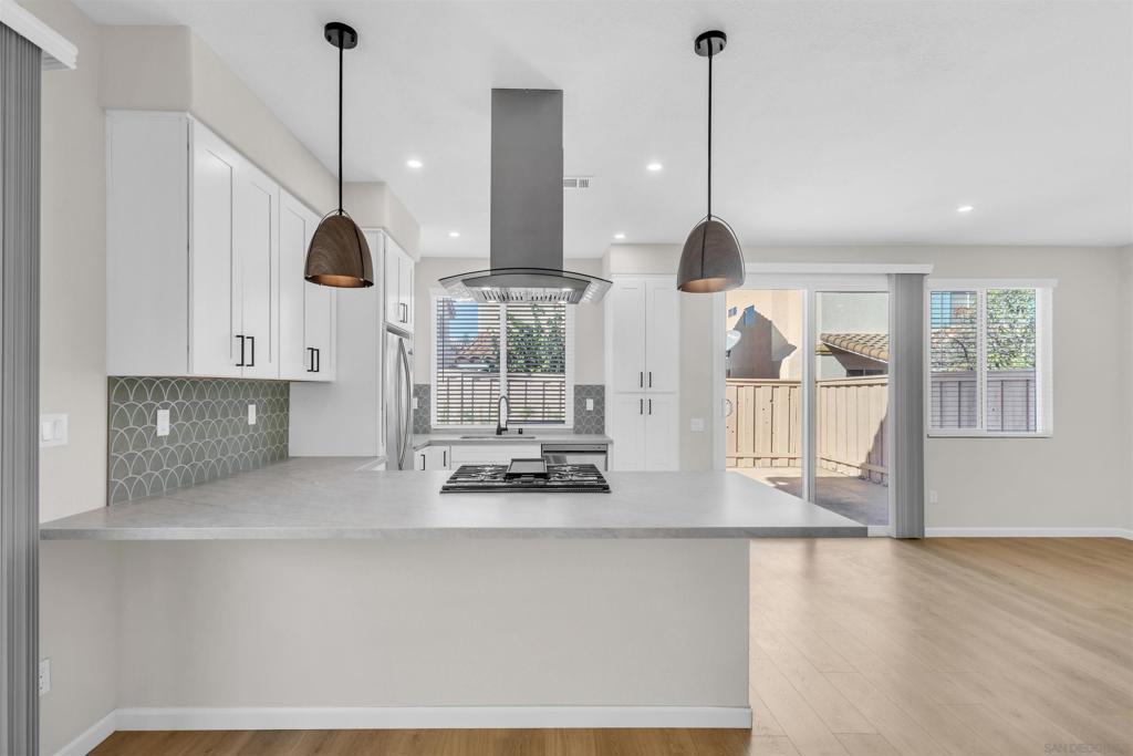 Beautiful, newly renovated 4 bed/2.5 bath home in quiet, gated Mira Mesa Neighborhood. NEW HVAC, NEW windows, NEW laminate flooring throughout with carpeted stairs. NEW kitchen and baths with Quartz countertops stainless steel appliances. Walking distance to parks, schools and restaurants. The community offers front yard maintenance and guest parking. Don't miss this turn-key home!  ** NOTE: Refrigerator was damaged in transit and will be installed prior to COE. It has been virtually staged for photos. Model information available upon request.