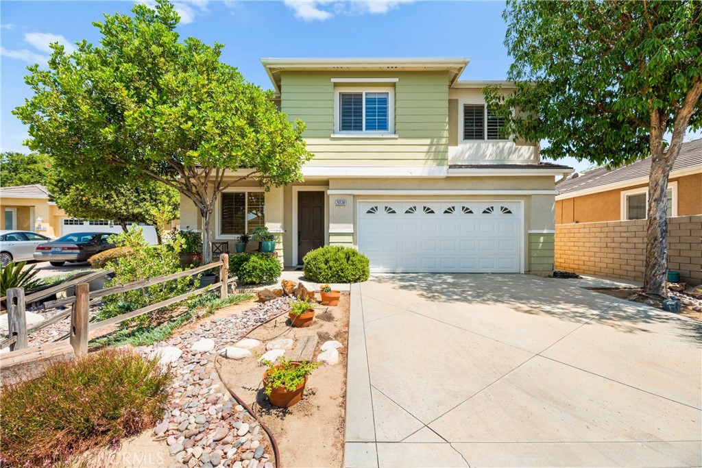 Welcome home to 26538 Roseate Circle, located in the gated 55+ Orchid/Primrose community at Pacific Mayfield in Menifee. This two story home offers 3 bedrooms, 3 bathrooms, and 2,398 sq. ft. of living space. This home has been beautifully maintained and offers a bright, open layout with neutral paint colors and an abundance of natural light streaming through numerous windows. The main floor features a spacious living room with a cozy fireplace, perfect for relaxing or entertaining. The kitchen is a chef’s dream with plenty of cabinetry, granite countertops, a large island, and stainless steel appliances. A water filtration system ensures fresh, clean water throughout. The tile flooring on the main level is accented with gorgeous wood inlay, and plantation shutters add elegance throughout the home. The main floor also includes a convenient bedroom and full bath, ideal for guests or multi-generational living. Upstairs, you’ll find the primary suite, an additional bedroom, a spacious loft, and a laundry room for easy access. The exterior offers low-maintenance landscaping with a drip irrigation system throughout the yard and is nestled on a quiet cul-de-sac. Solar panels and a Quiet Cool whole house fan help keep energy costs low, adding to the home’s efficiency. Enjoy resort-style living with community amenities such as a pool, spa, pickleball courts, community center, and scenic walking paths—all within the security of a gated community. Come take a look—you’re sure to fall in love!