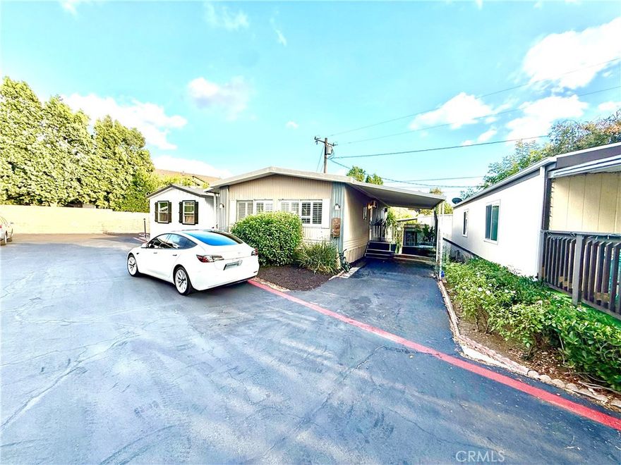 Welcome to this charming 2-bedroom, 2-bath manufactured home located in one of Rancho Cucamonga’s most desirable communities near Foothill Blvd and Hellman Ave. This bright and open layout features a spacious living and dining area filled with natural light through beautiful plantation shutters, offering both elegance and energy efficiency. The kitchen opens to the living room and includes granite-style countertops, great lighting, and stainless steel stove. With wood-look flooring throughout, a great yard perfect for relaxing or entertaining, and parking for up to two vehicles, this home combines comfort and convenience. Enjoy all the benefits of living in Rancho Cucamonga — award-winning schools, the vibrant Victoria Gardens lifestyle center, parks, and easy access to shopping, dining, and major freeways. Experience one of the Inland Empire’s most sought-after cities in this cozy and affordable home!