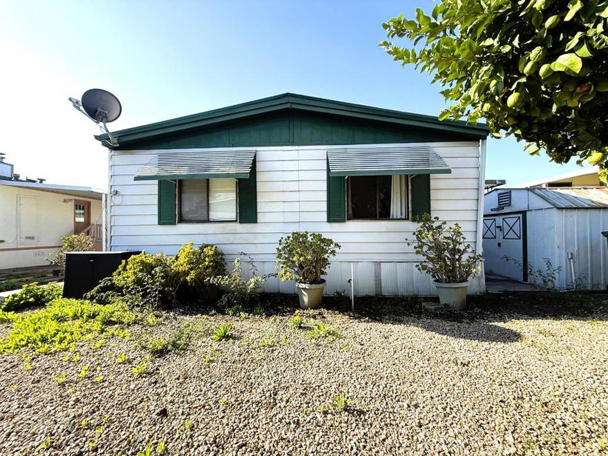 Explore this charming 1976 home located in the Casa Alondra Community. It is approximately 1,536 square feet, featuring 3 bedrooms and 2 bathrooms. The living room and dining area are both carpeted, complemented by upgraded light fixtures. The kitchen features linoleum flooring and is equipped with a refrigerator, stove, garbage disposal, and an island. One bedroom showcases laminate flooring and the master bedroom is carpeted. The master bathroom along with the guest bathroom has linoleum flooring, featuring both a tub and shower. The home is equipped with central AC and heating. Enjoy a backyard with one shed, a utility room with linoleum flooring, and a laundry area that includes a washer and dryer. Stop By Today!