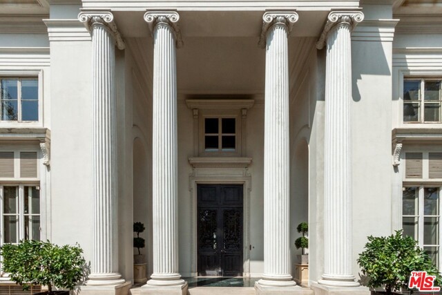 The Chandler House - a very rare opportunity to restore & update a brilliant Neoclassic estate designed by Wallace Neff for The Ralph J. Chandler family. Adjoining the Wilshire Country Club, this majestic home was inspired by the Chateau de Louveciennes; over 8000 sq ft of barely touched grand space & scale! The public rooms are all extraordinary with regal details, including exceptional balustrades, intricate moldings, light fixtures, and a majestic 30 ft high rotunda entry. A sweeping staircase leads to three large bedroom suites & an impressive library w/ rich paneling & beautiful views. Perfect for entertaining, the outside grounds include an enormous marble terrace w/ columns, a fountain & formal garden design all looking out to tranquil golf course greens. Also includes two staff Bds & Ba, elevator, & underground parking for multiple cars. Very first time on the market! For the buyer who wants to create the next chapter in the history of this important storied residence.