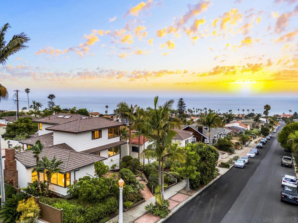 Welcome to coastal living in the heart of Sunset Cliffs! This 4-bedroom, 3-bath, 2,398 sq. ft. residence blends timeless 1949 character with thoughtful updates for modern comfort. Situated on a 6,900 sq. ft. lot, the property offers rare and protected ocean view corridors thanks to a Grant of View easement recorded in 1996, preserving your natural light, privacy, and blue-water vistas for generations to come. Step inside to find refinished hardwood floors, a remodeled kitchen with quartz countertops, custom cabinetry, and stainless steel appliances, along with updated baths and fresh interior/exterior paint. The flexible floor plan offers multiple living spaces, a cozy fireplace, and a serene primary suite. Outdoor areas feature tiled and flagstone patios, mature landscaping, and a detached one-car garage with alley access. Located just moments from Sunset Cliffs Natural Park, beaches, and vibrant local dining, this home is a rare opportunity to secure a legacy property in one of San Diego’s most sought-after coastal communities. Welcome to coastal living in the heart of Sunset Cliffs! This 4-bedroom, 3-bath, 2,398 sq. ft. residence blends timeless 1949 character with thoughtful updates for modern comfort. Situated on a 6,900 sq. ft. lot, the property offers rare and protected ocean view corridors thanks to a Grant of View easement recorded in 1996, preserving your natural light, privacy, and blue-water vistas for generations to come. Step inside to find refinished hardwood floors, a remodeled kitchen with quartz countertops, custom cabinetry, and stainless steel appliances, along with updated baths and fresh interior/exterior paint. The flexible floor plan offers multiple living spaces, a cozy fireplace, and a serene primary suite. Outdoor areas feature tiled and flagstone patios, mature landscaping, and a detached one-car garage with alley access. Located just moments from Sunset Cliffs Natural Park, beaches, and vibrant local dining, this home is a rare opportunity to secure a legacy property in one of San Diego’s most sought-after coastal communities.