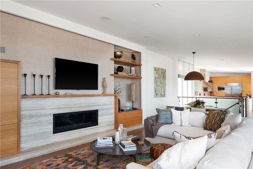 The Ocean Views from the living room and entire top level are the views you have been looking for in a beach home.  Situated in the perfect part of North Hermosa Beach and just a short walk to downtown Manhattan Beach, this exquisite elevator-equipped home is a true opportunity in the South Bay.  
The heart of the home is the open-concept top level, bathed in natural light and featuring sweeping ocean views to the south, west, and north.  Expansive Fleetwood Windows face the Pacific Ocean and large bi-fold doors open to a spacious deck, creating a perfect setting for indoor-outdoor living and entertaining. The kitchen, equipped with high-end appliances, and the living and dining areas flow effortlessly, enhancing the home’s welcoming atmosphere.
The middle level is home to three bedrooms, including the primary suite, which boasts a luxurious en-suite bathroom with dual sinks, a walk-in shower, and an expansive walk-in closet. Two additional en-suite bedrooms are thoughtfully designed for privacy and comfort.
The lower level offers a guest room equipped with a seamlessly built in murphy-bed, a bathroom, and a versatile bonus room that opens to a private backyard retreat, complete with a built-in firepit—ideal for relaxing or hosting gatherings.
With clean lines, warm finishes, four-car parking, a three-stop elevator, multi-zoned air conditioning, and the benefit of underground utility lines ensuring beautiful views, this home combines style, comfort, and convenience.  Set on a one-way street, this 3,500+square-foot contemporary residence seamlessly blends modern design with coastal elegance.