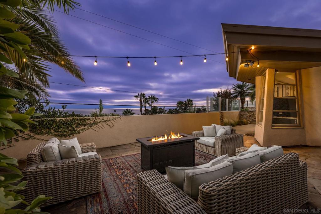 Welcome to your dream home in Del Mar, where coastal elegance meets modern luxury. This spectacular residence offers breathtaking panoramic whitewater ocean views that sweep across the living room, dining room, and master suite, providing a continuous connection to the serene beauty of the Pacific Ocean. Designed with a warm contemporary style, this home lives effortlessly like a single-story, ensuring comfort and accessibility. The open floor plan maximizes natural light and showcases the mesmerizing ocean vistas, creating an inviting and tranquil atmosphere throughout.
