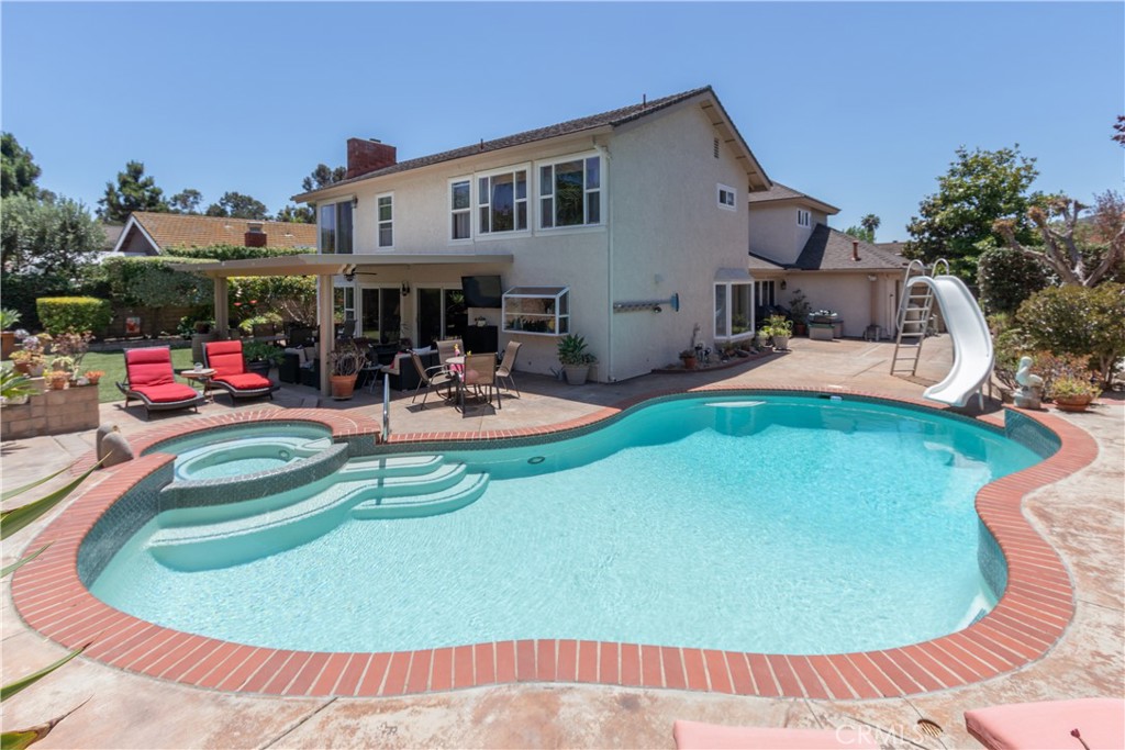 Adjusted $150,000. Sellers purchased another home to return to their family & relatives. There is a 4-car garage space w/3 garage doors w/enclosed space used as a workout room. Incredible entertaining backyard offers private covered patio for relaxation & enjoying the comfort of a heated pool/spa w/ plenty of fruit trees. Recently painted in a soft, cool color as you enter into the covered area to the double front door. Enter into the foyer w/soaring ceiling & multiple doors & windows adding natural lighting to the popular Plan 6 in Mission Springs. Offering a downstairs den/office which could be a 4th bedroom along w/ a downstairs bath w/walk-in shower. A family room extends from the kitchen accented w/crown molding, cozy fireplace, ceiling fans. The kitchen w/ recessed lighting, bay window looking out to the spacious backyard, stainless steel appliances & tiled counters. Windows extend on the back wall of FR for cross ventilation. Enter into the Formal dining room from the kitchen w/framed window looking out to the side yard. Curved stairway to second story leads to an amazing primary bedroom w/additional step-up sitting area with gas fireplace. Updated attached primary bath, jacuzzi tub, separate shower & walk-in closet. Additional secondary spacious bedrooms w/bath, shower, double sinks. A large bonus room that offers a grand recreational room, additional bedrooms, gym, hobby room or just a great space of your choice. Close to hiking, biking trails to beach, downtown historic SJ, community parks & the new "River Walk" w/shopping, restaurants & a great place to gather. Visit the historic Mission & join in all the activities & "Music Under the Stars" summer performances. No Association fees and low tax base