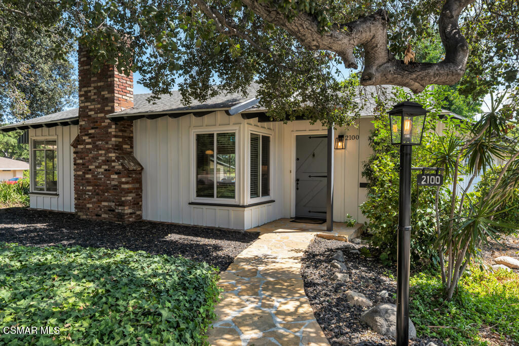 Fabulous Fox Ridge Estates... the home you have been waiting for! Welcome to this charming Cliff May inspired Western Ranch, originally featured as the model home in the 1953 ''Fabulous Fox Ridge Estates'' advertisement. Showcasing hallmarks of May's celebrated California Ranch influence, this charming 3 bedroom, 2.5 bath home showcases exceptional design elements from the U-shaped floor plan, seamless indoor-outdoor living spaces, picture windows and abundant natural light. As you meander up the path to the home, step inside the entryway into a spacious living room with preserved wall paneling, wainscoting, a cozy fireplace, and windows looking out to views of a majestic oak tree and the mountains. The sunny kitchen also overlooks the scenery, with updated appliances and an adjacent room perfect for use as an office area, breakfast room or additional pantry/laundry area. The dining room sits conveniently at the center, featuring another fireplace and overlooking the redesigned upper stone patio with several charming seating areas for tranquil California evenings relaxing at home. Down the main wing of the home you will find a spacious primary suite with updated en-suite bath and dedicated laundry. Another spacious secondary bedroom and full bath complete this side of the home. The opposite side of the home features another bedroom and half bath.Your fully enclosed backyard is designed for both relaxation and entertaining, featuring a spacious upper stone patio--ideal for evenings by the fire pit under the stars--and a lower grassy area perfect for play. The property is complete with a detached 2-car garage wired with 220V, making it EV-ready.Additional highlights include hardwood flooring, upgraded electrical panel, solar, updated appliances, new water heater and a newer modern garage door rollup with wi-fi connectivity. This beautiful home is situated in a tranquil foothill community, removed from the bustling city and yet close to all the museums, art galleries, shops and restaurants that Pasadena is known for. Nature enthusiasts will appreciate the close proximity to hiking and other outdoor activities. Evening strolls reveal a friendly community, peaceful surroundings, and breathtaking canyon vistas. This midcentury gem blends architectural history with modern amenities offering an ideal retreat not to be missed!